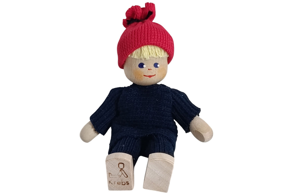 Anne Krebs Miniatur Puppe Mädchen blond mit roter Pudelmütze