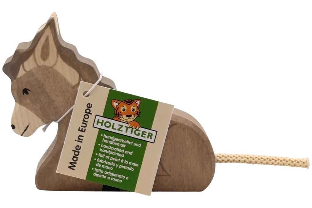 Holztiger Esel liegend